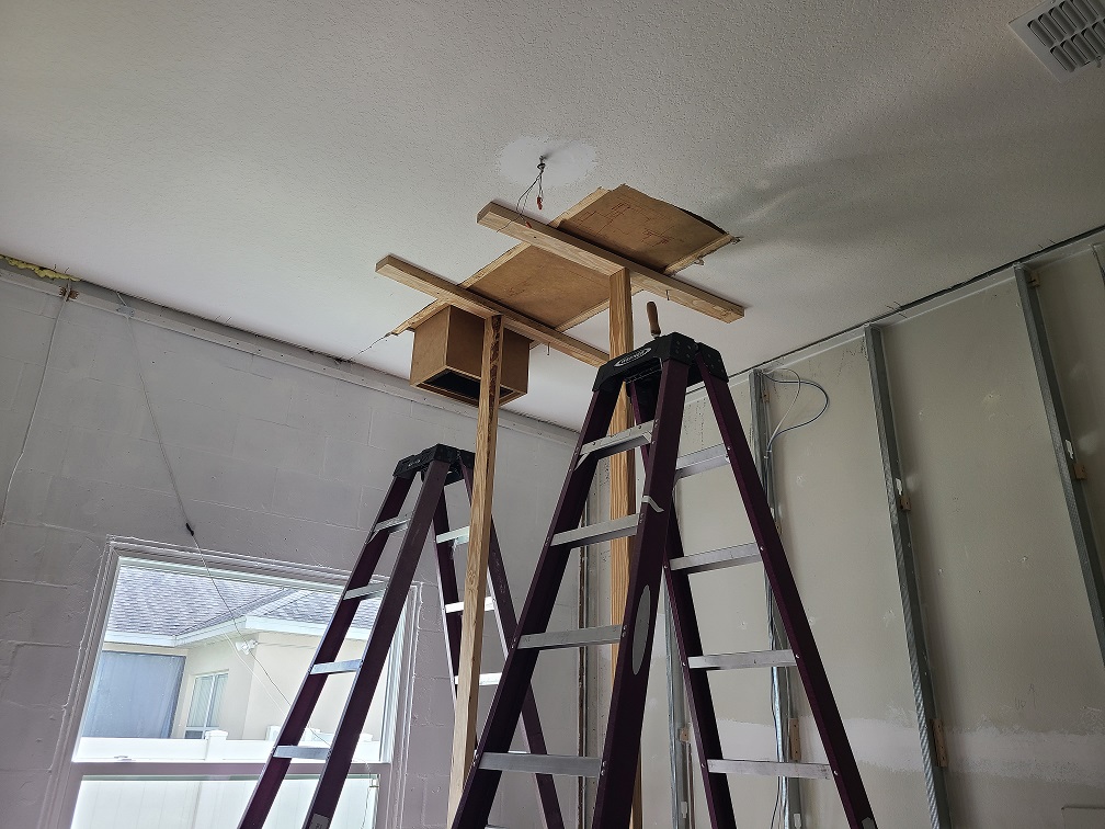 Silencer box being positioned above the studio