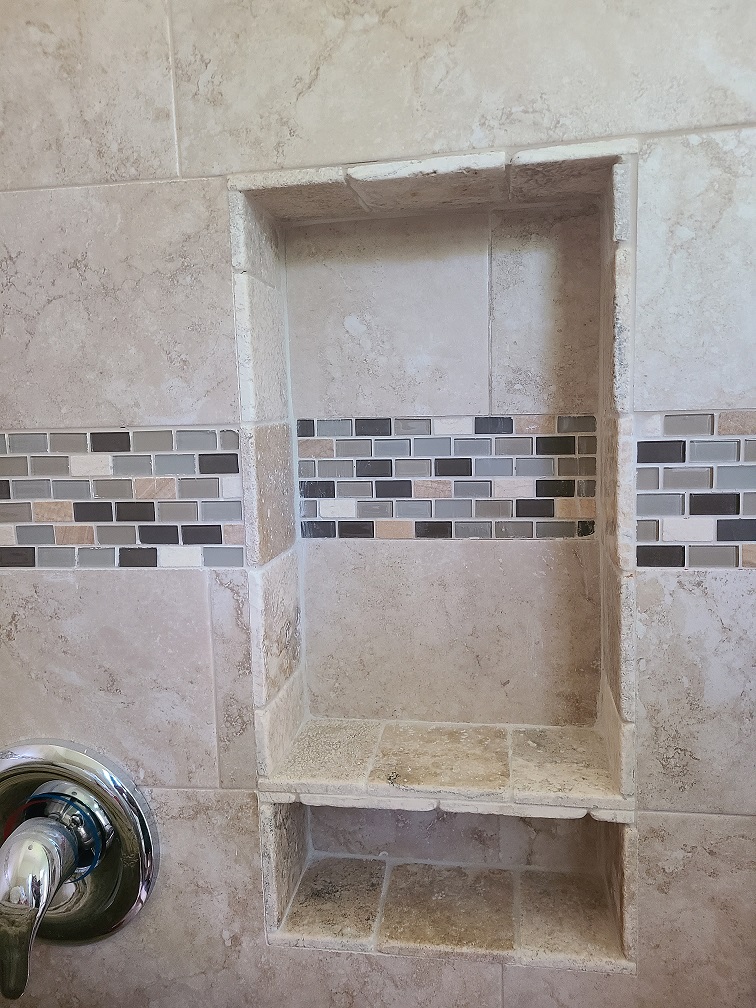 Shower tile repair during studio construction